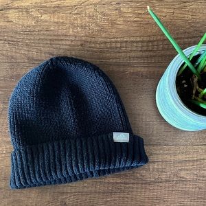 Adidas recycled knit beanie with leather tag.